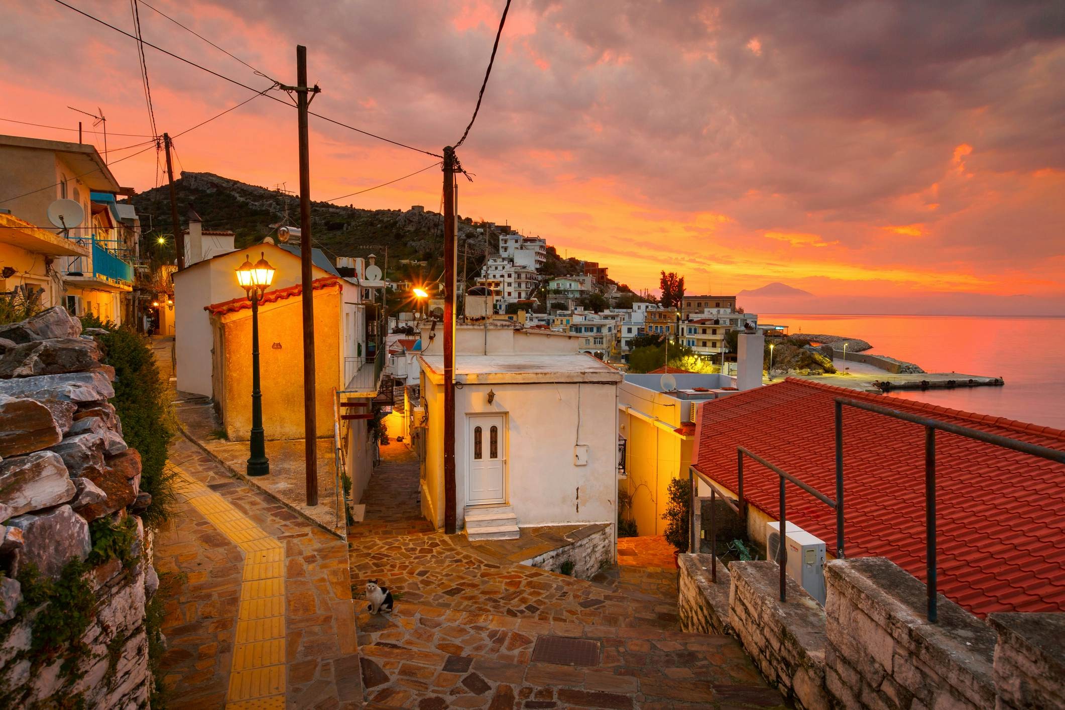 The streets of Agios Kirikos village on Ikaria island in Greece at sunset