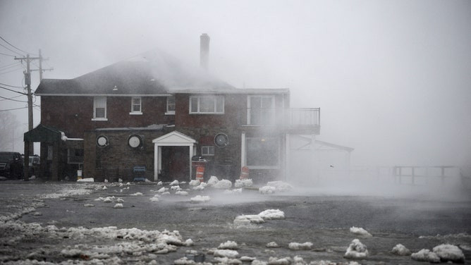 Lake Erie waters wash over the shoreline on December 23, 2022 in Hamburg, New York. 