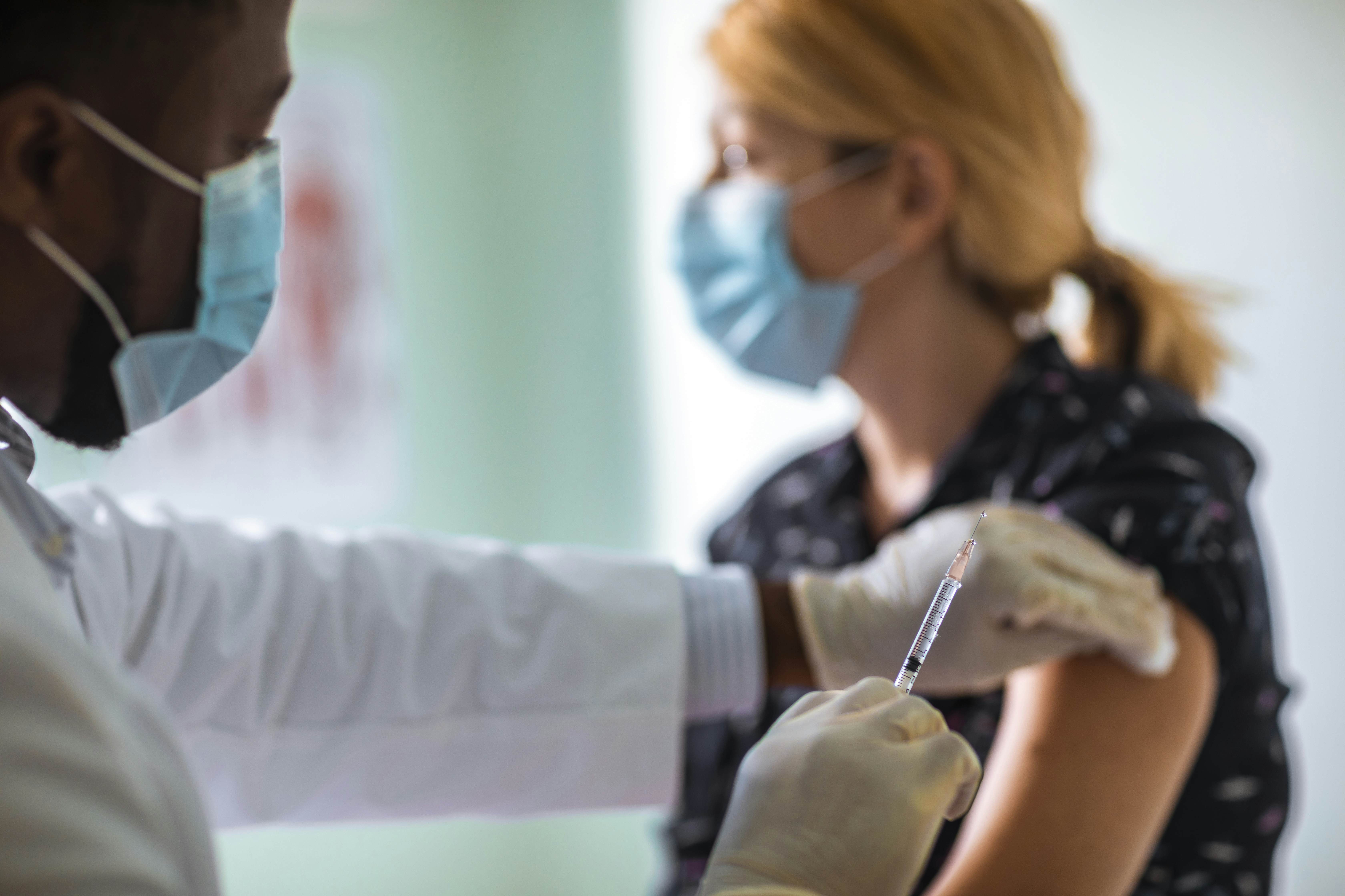 Vaccine distribution concept with vials and syringes