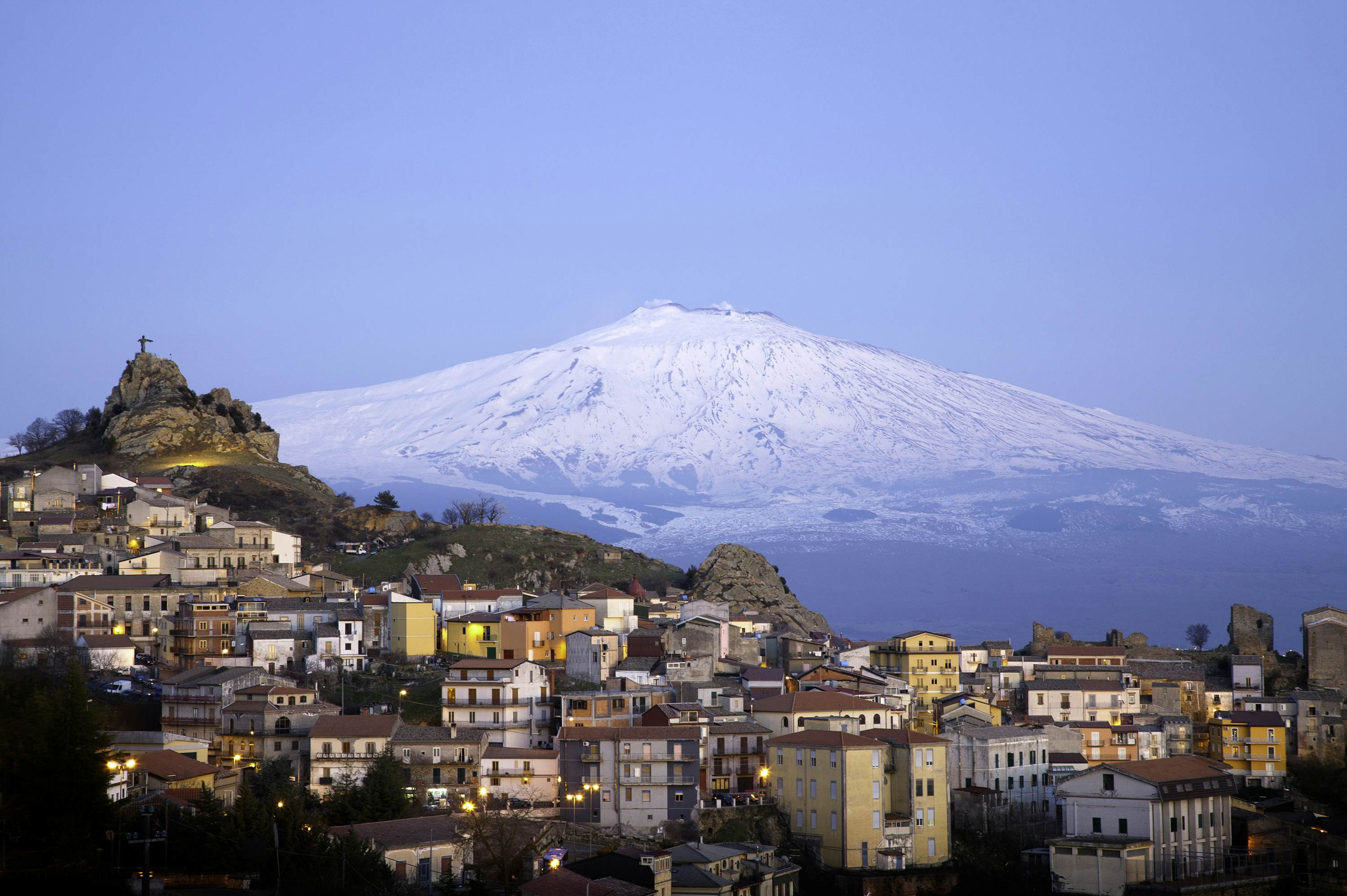 The village of San Teodoro with Mt Etna in the background, showcasing the scenic beauty of Sicily, Italy.