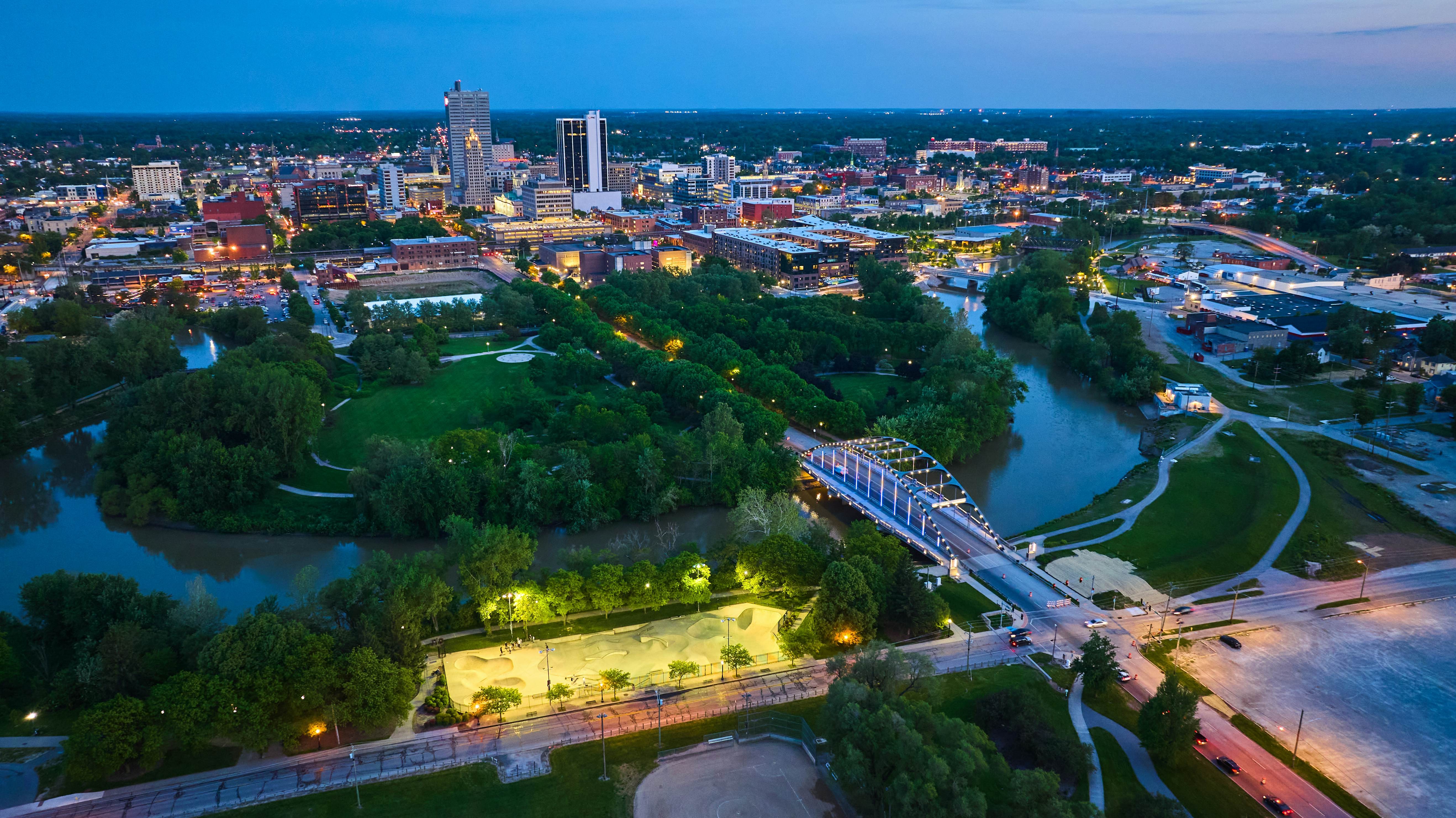 Image of Night lights in skate park near MLK bridge leading into nightlife downtown Fort Wayne aerial