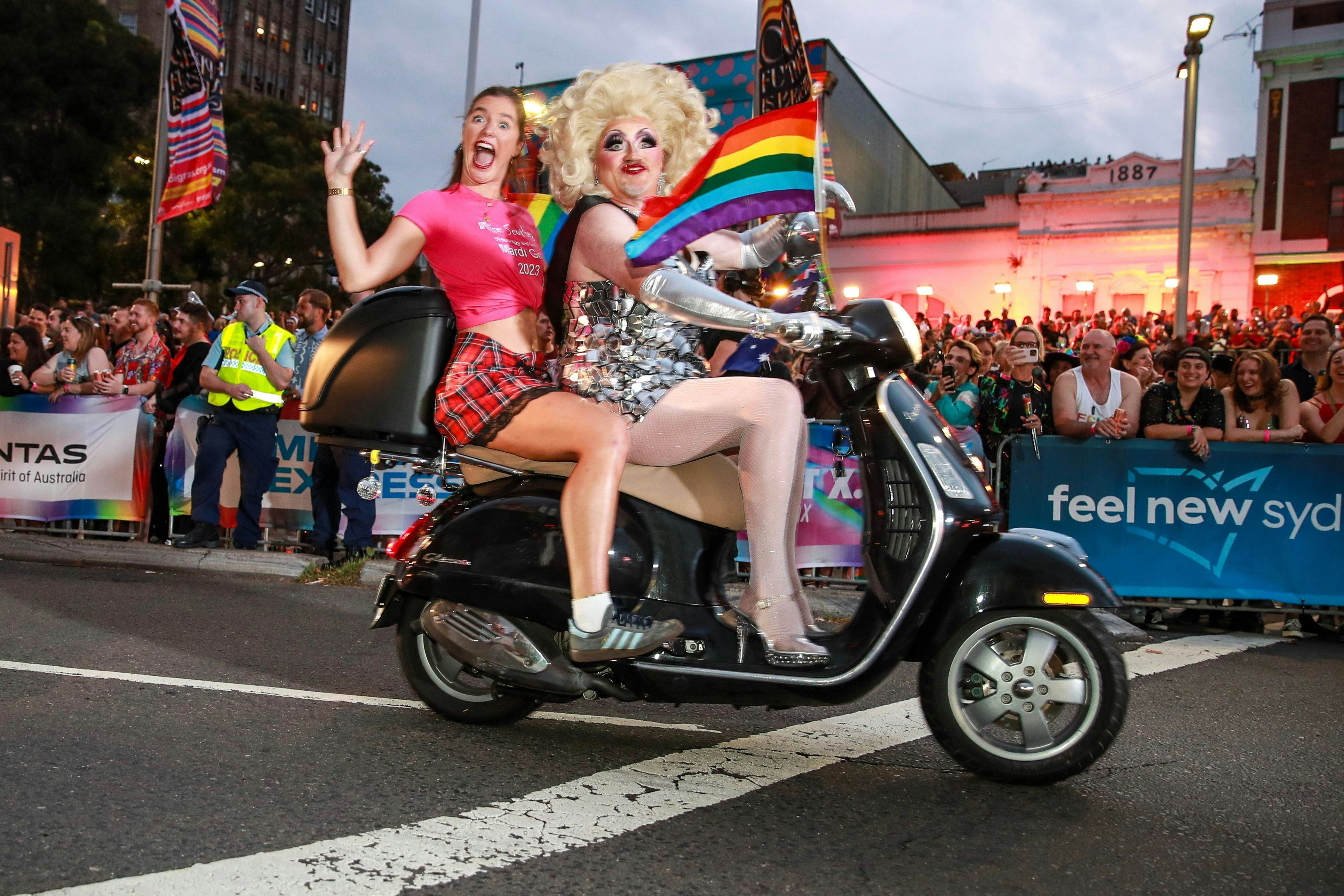 A drag queen and passenger on a motorcycle at Sydney Gay &amp; Lesbian Mardi Gras, Sydney, New South Wales, Australia.