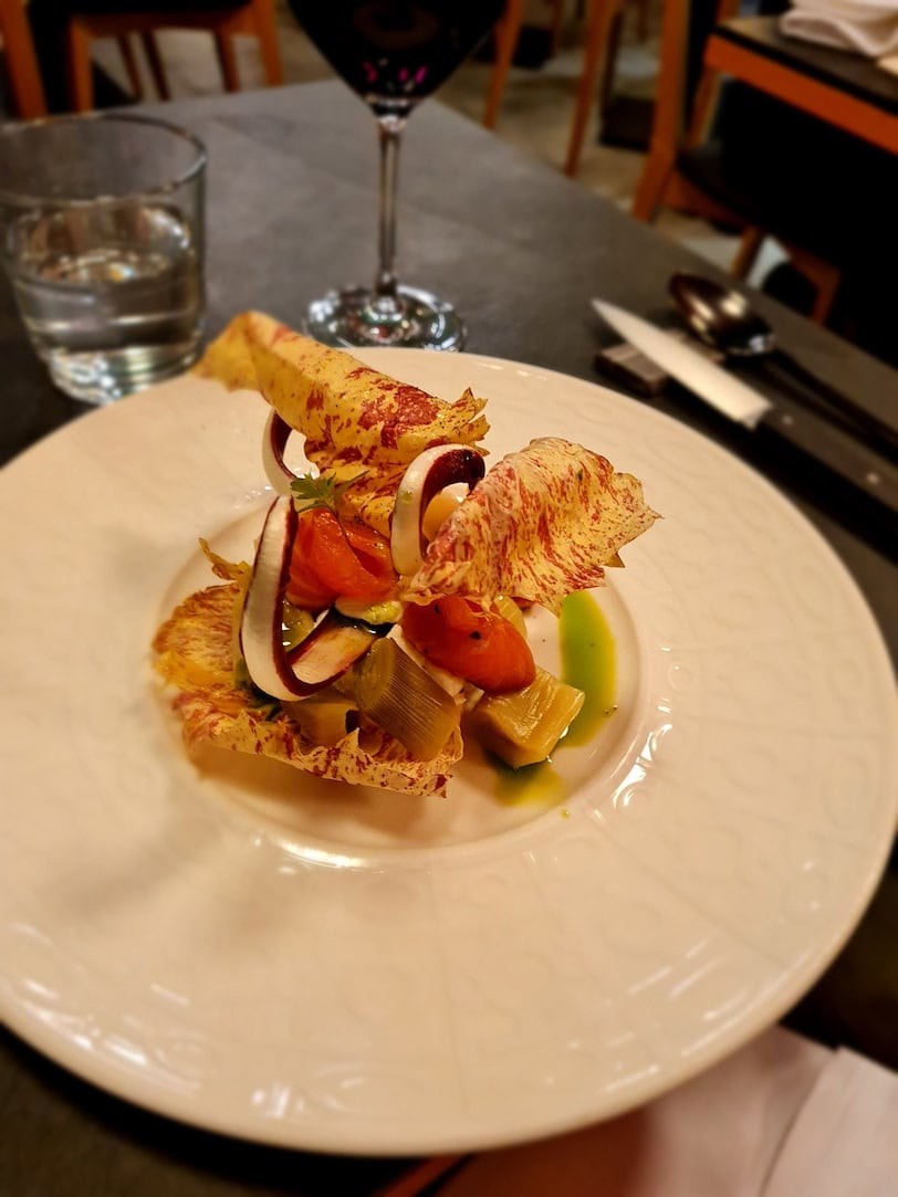 Artfully plated salad at a restaurant in Paris