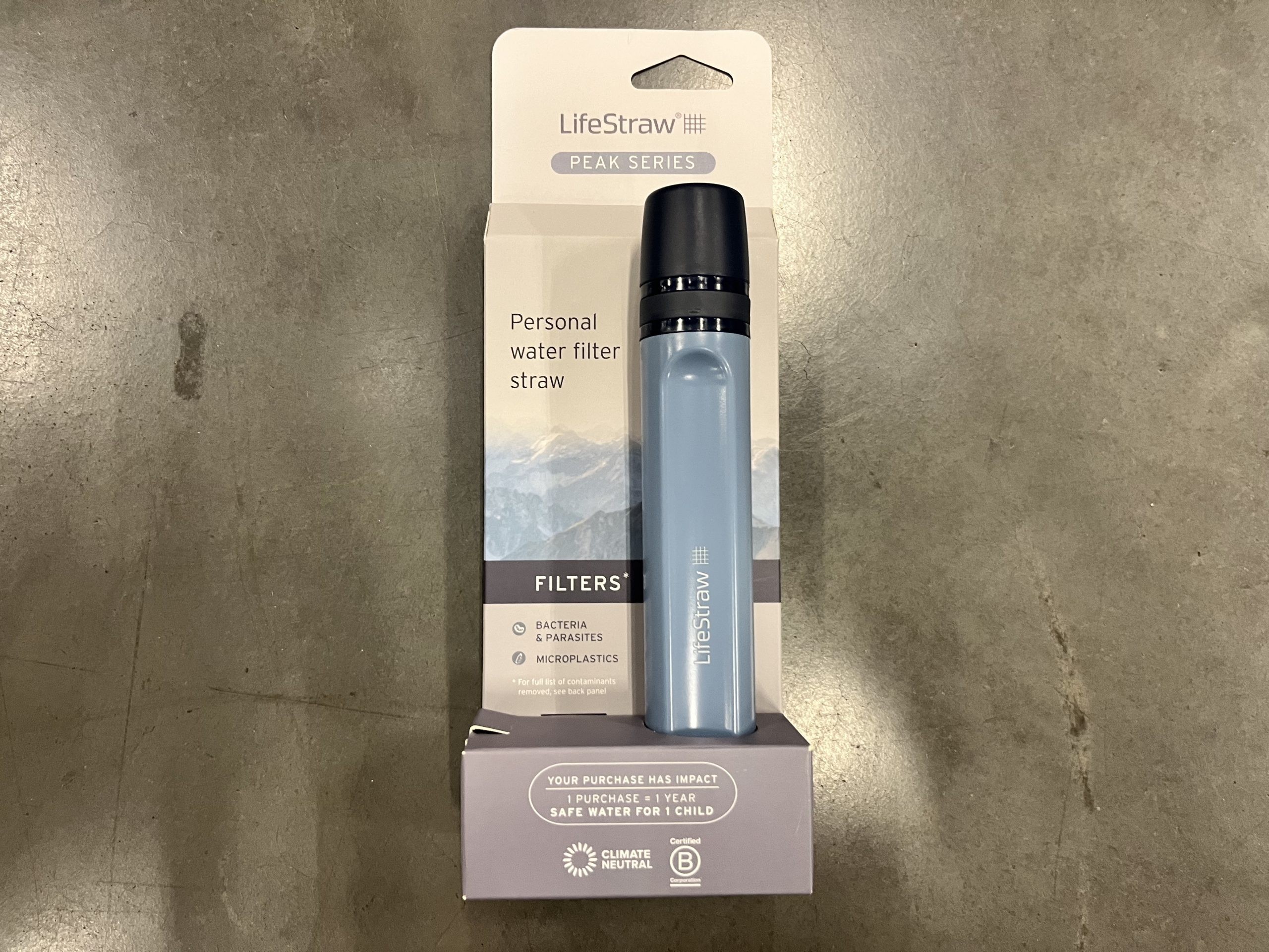 A Peak Series LifeStraw personal water filter straw in its original packaging