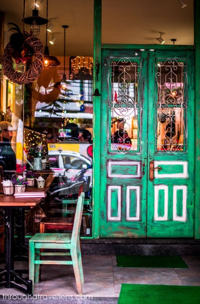 Enjoying a traditional Vietnamese coffee at a charming café, a must-do experience in Hanoi.