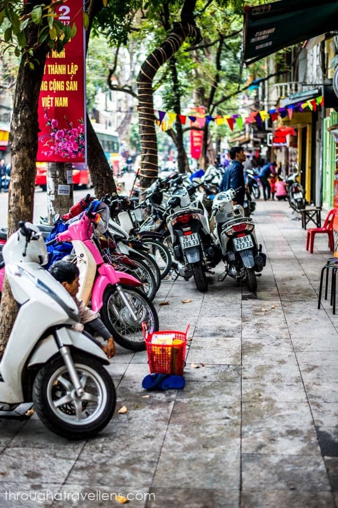 Navigating the bustling streets of Hanoi with ease on a rented motorbike, a popular choice for independent travelers.