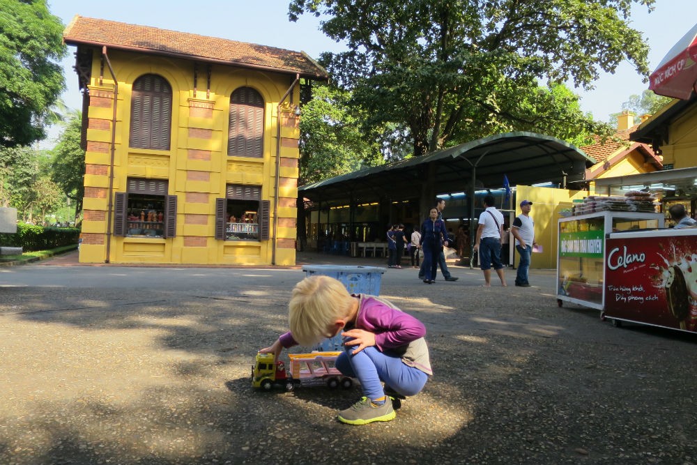 Zeke plays outside the Presidential Palace in Hanoi. Toys can be helpful for when your kid just doesn’t want to walk through another museum.