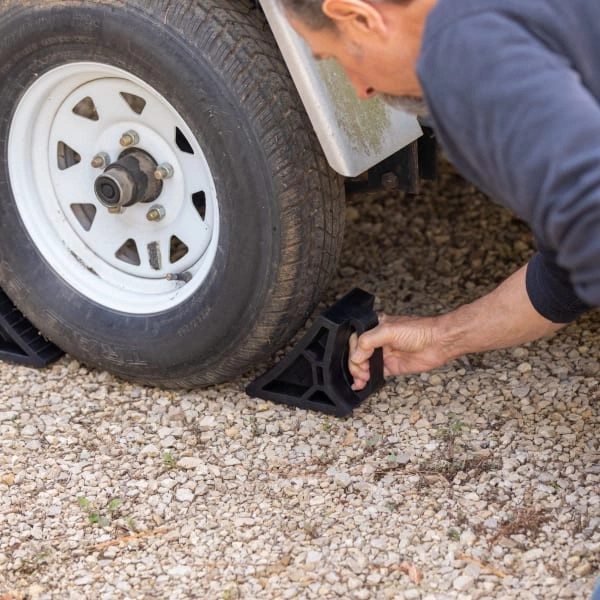 RV wheel chocks placed around the tire