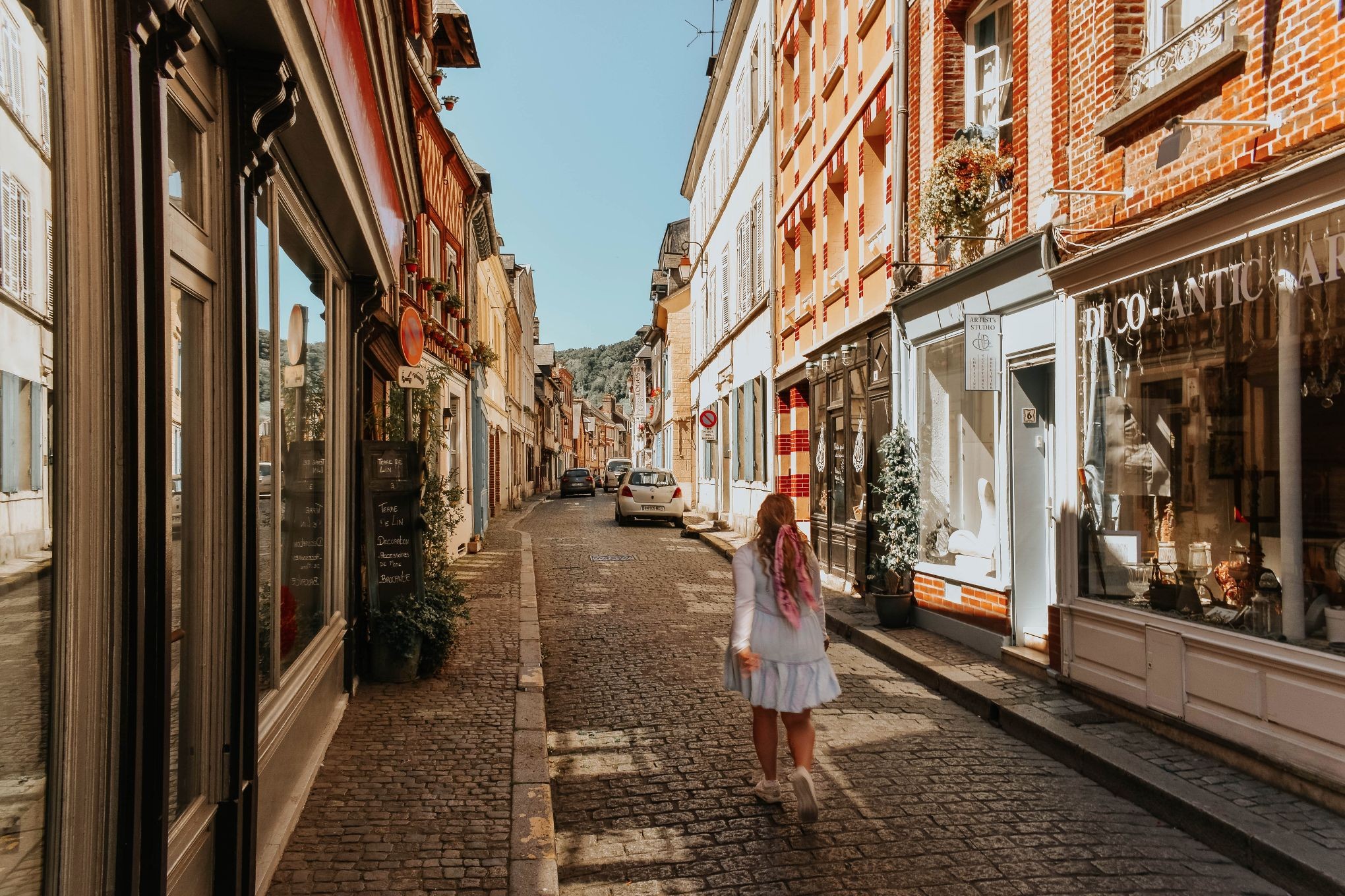 Picturesque street in Honfleur with colorful buildings, embodying the artistic charm of the town