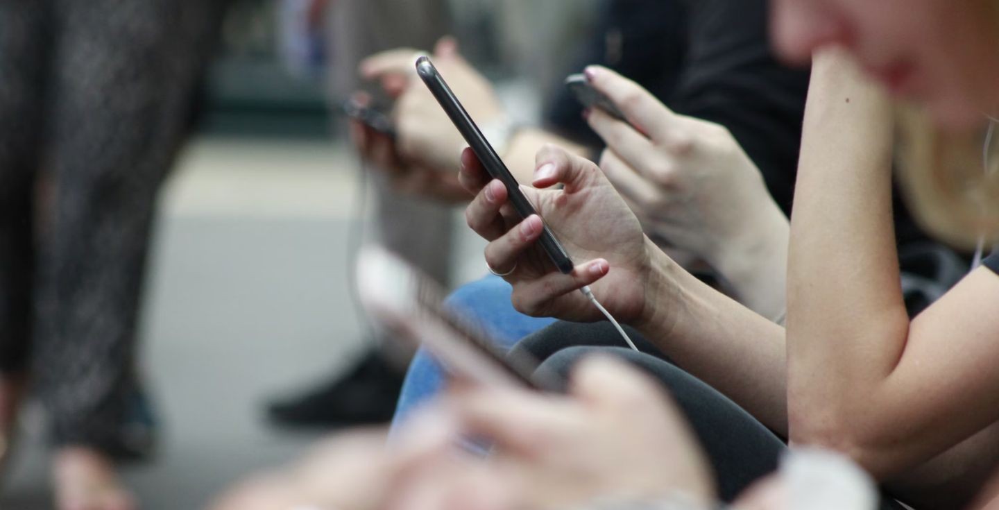 Woman using mobile phone while traveling