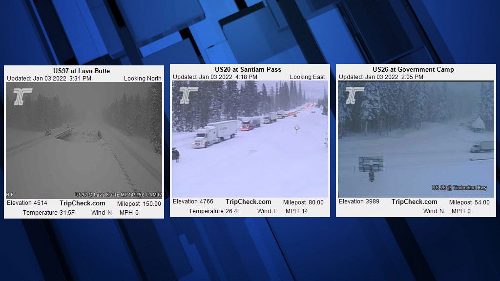 An ODOT TripCheck road camera captures snowy conditions on Highway 20 at Santiam Pass.
