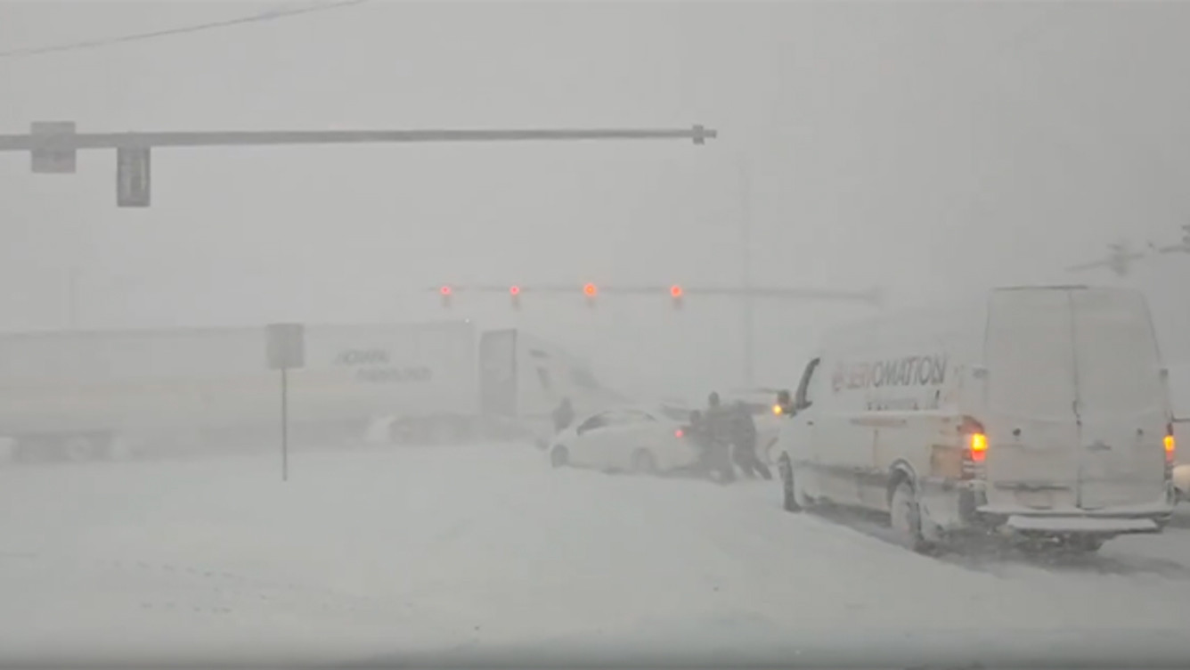 Lake-effect snow creates chaos on the roads of Hamburg, New York, making road identification difficult