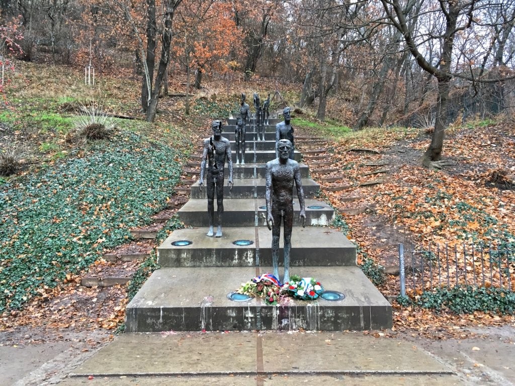 Memorial to the Victims of Communism, depicting bronze figures descending a flight of stairs, by Olbram Zoubek, Jan Kerel and Zdenek Holzel in Prague, Czech Republic