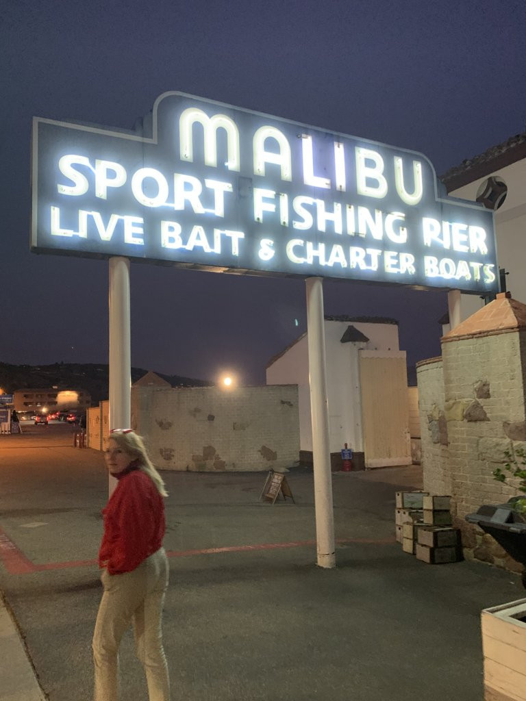Malibu Sport Fishing Pier signage in neon at night