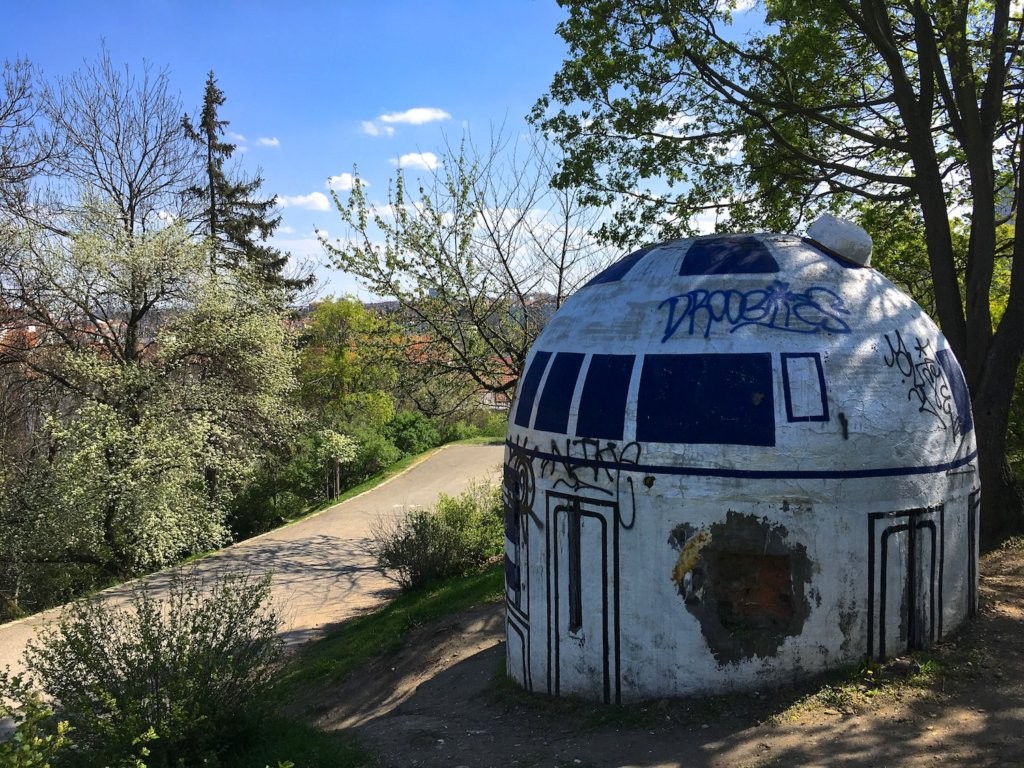 Statue of R2-D2 created by unknown street artists by redecorating a ventilation shaft connected to an abandoned nuclear bunker in Folimanka Park, Prague, Czech Republic