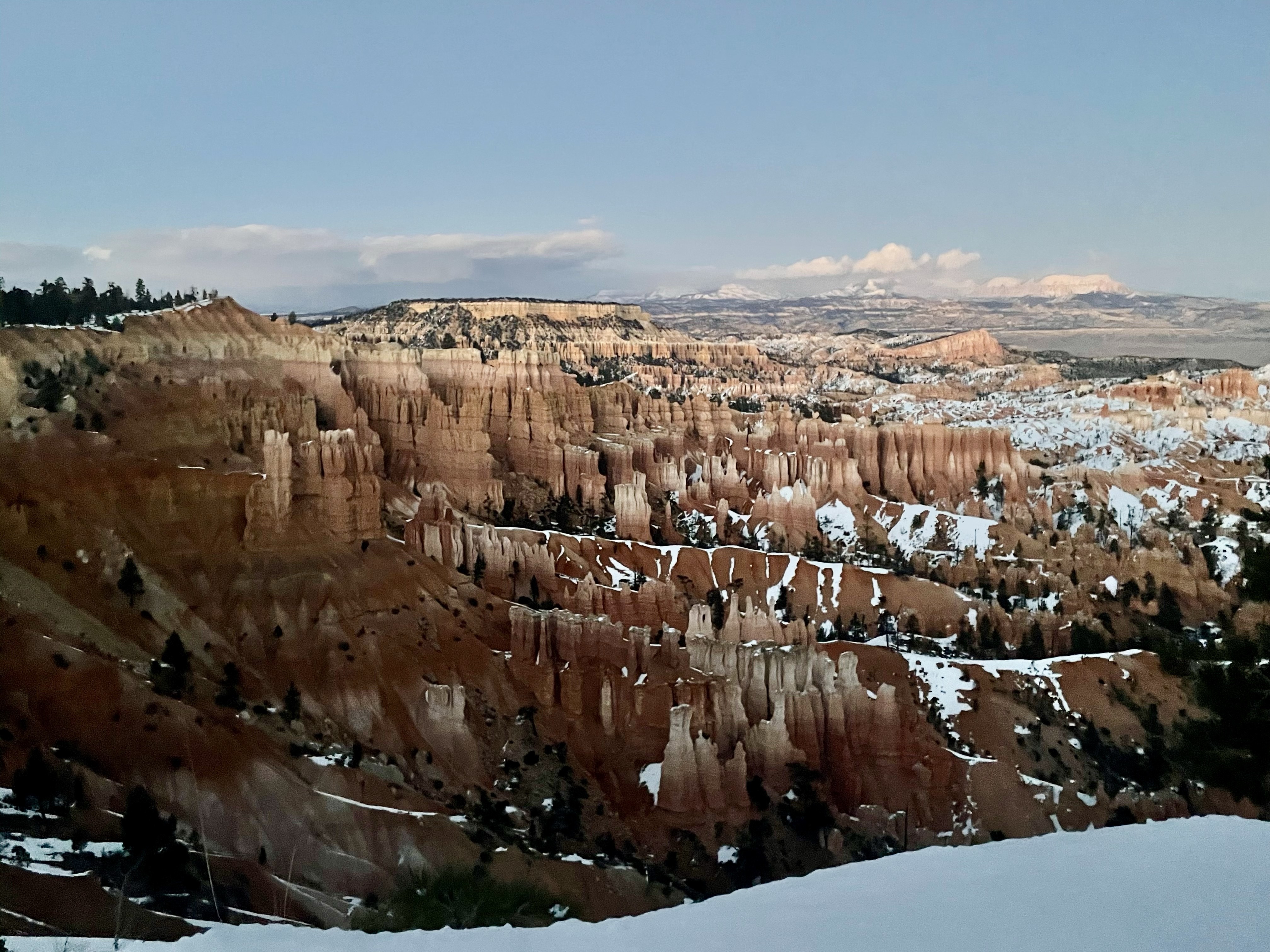 A snow-capped Bryce Canyon view during a Spring Break road trip, highlighting the unexpected beauty of winter travel in 2021