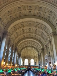 Interior view of the Boston Public Library, showcasing its stunning architecture and artwork.