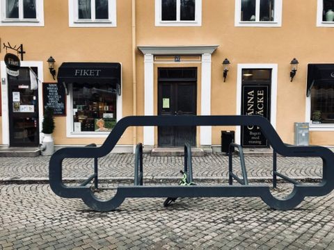 Cobblestone streets and the entrance to Fiket, a charming café in Gränna, Sweden.