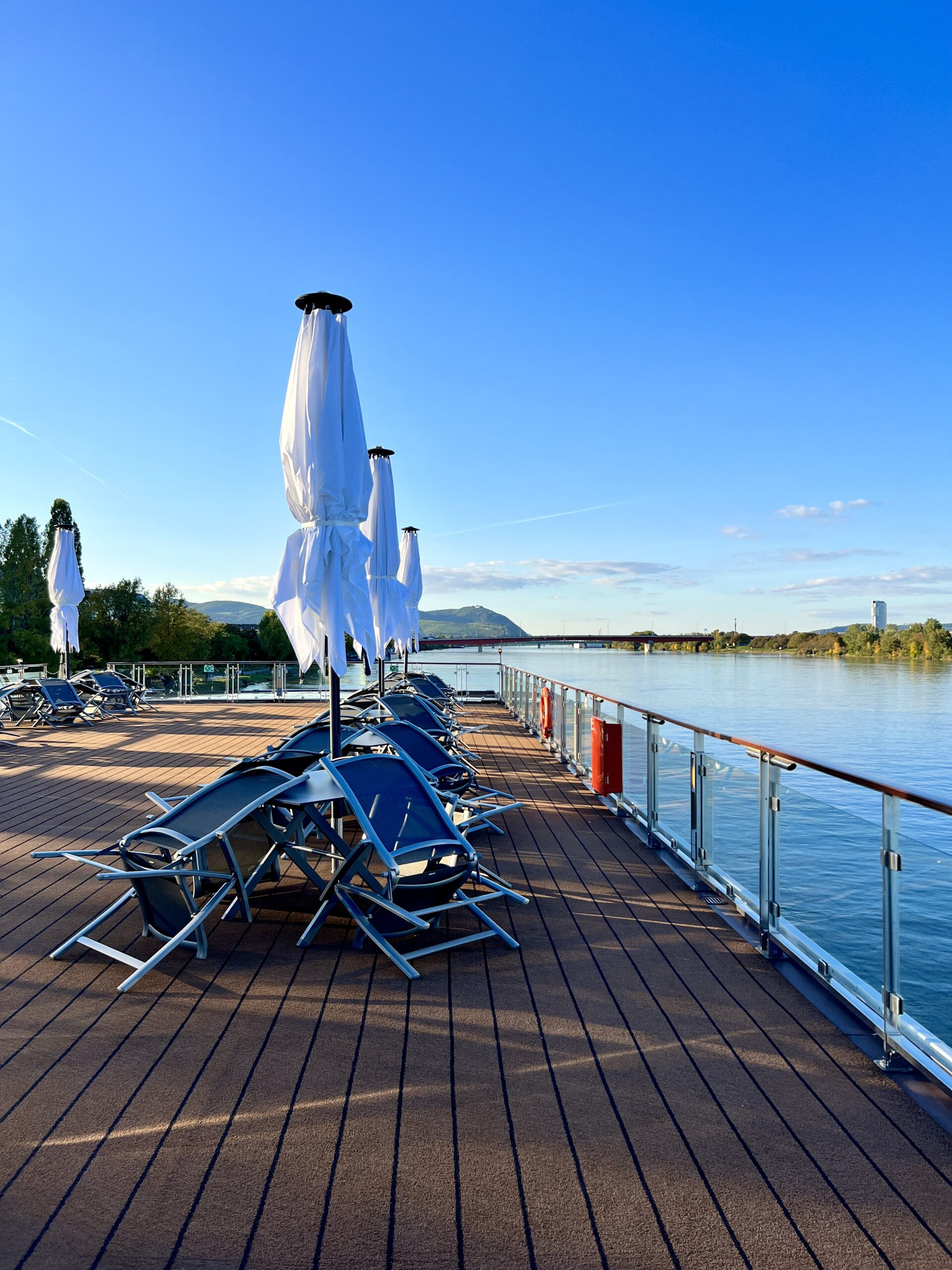 Cruise ship deck with swimming pool and lounge chairs