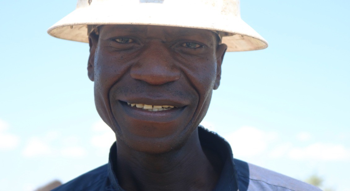 A 52-year-old farmer in the Lukanda Agriculture Camp greets our team, reflecting the personal connections made