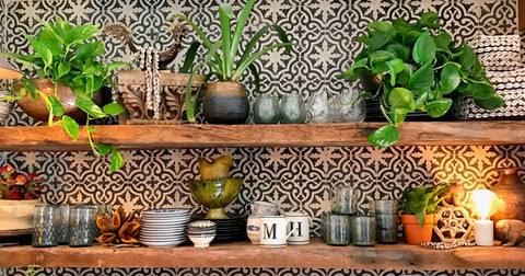 Open shelves displaying odd collections and encaustic tile, blending Moroccan and Indian elements in the kitchen design, part of the India World Traveler Collection