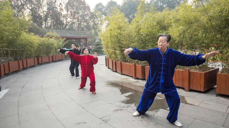 Person performing Tai Chi with a sword in Chengdu, China
