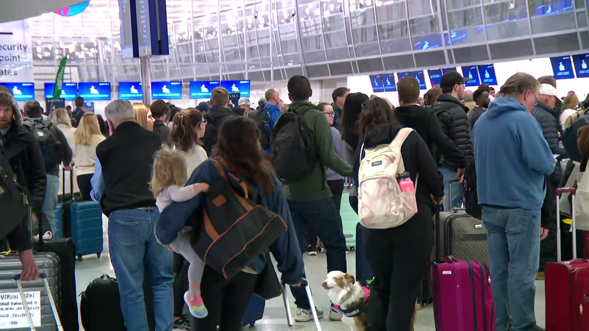 Travelers using mobile phones at the airport