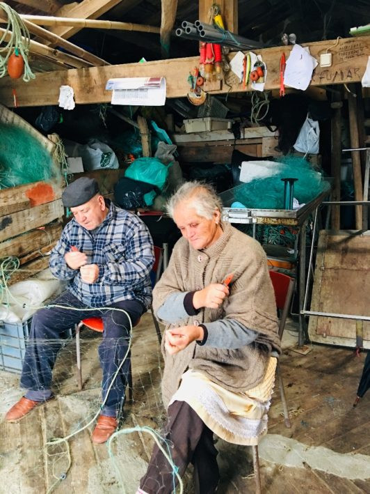 Seven stellar chefs in Portugal - repairing fishing nets.