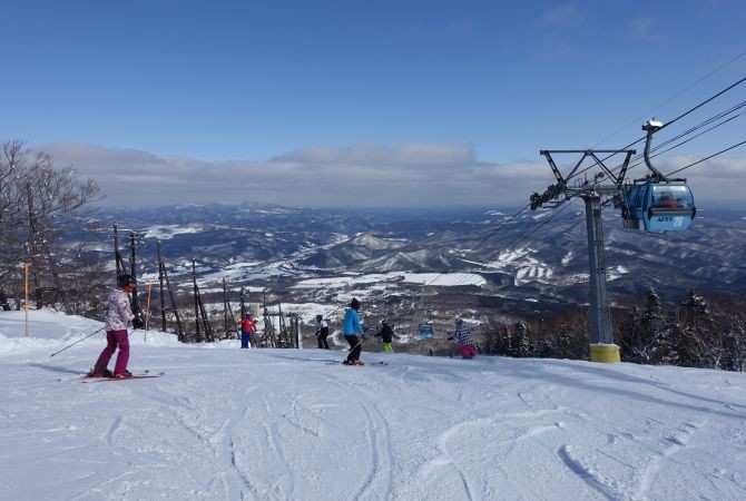 Skiers enjoying the slopes at Appi Kogen, one of Japan's premier ski resorts near Morioka.