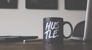 Mug with word hustle