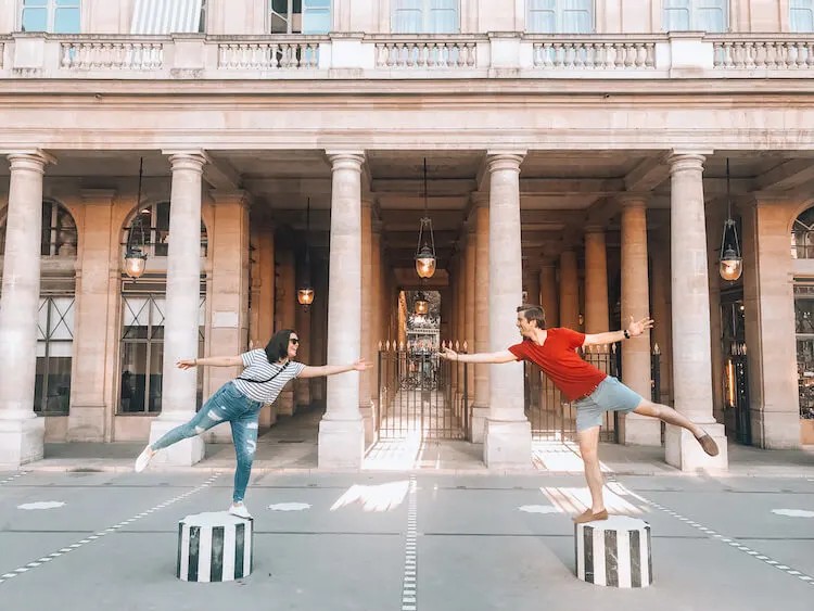 Exploring the Palais Royale area, Paris. Alt Text: Couple exploring the Palais Royale area in Paris, enjoying the sights and sounds of the city