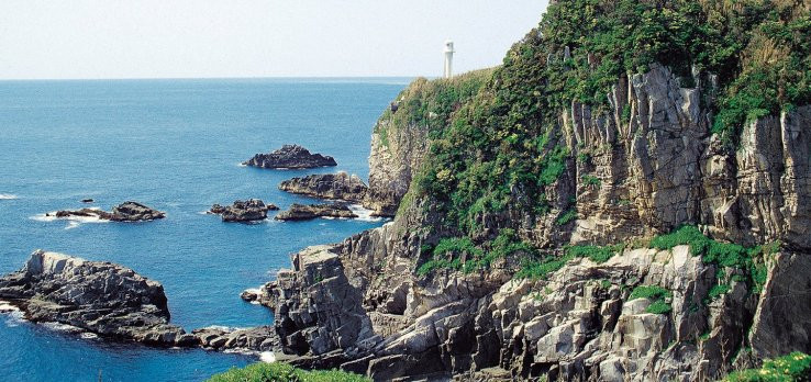 Cape Ashizuri is a promontory featuring an observation area with sweeping views of the ocean and the nearby lighthouse