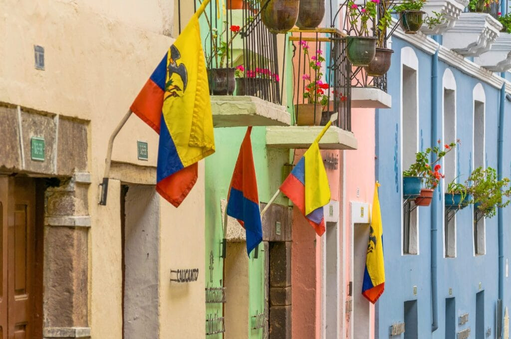Colorful facades of houses in Calle de la Ronda, Quito, Ecuador, showcasing the unique architecture and vibrant atmosphere for Quito tourism