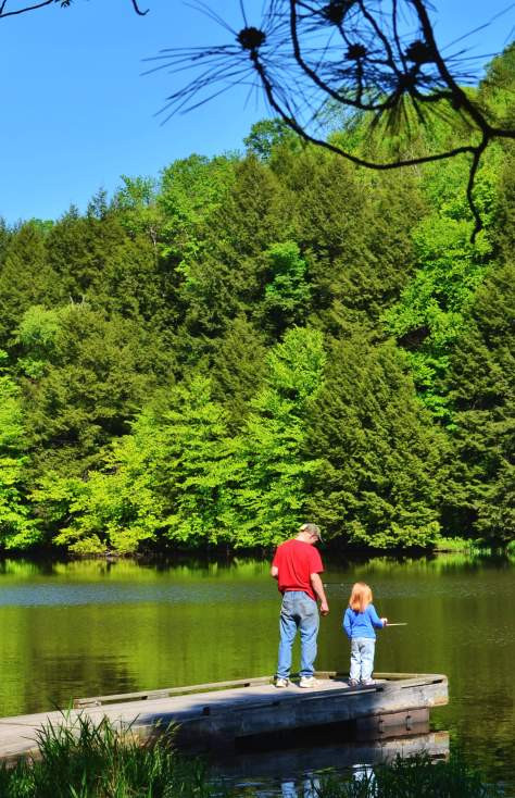 A kid fishes in Lackawanna State Park in North Abington Township PA