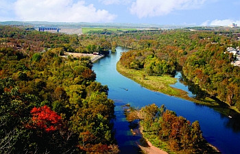 A scenic view of Lake Taneycomo surrounded by lush greenery