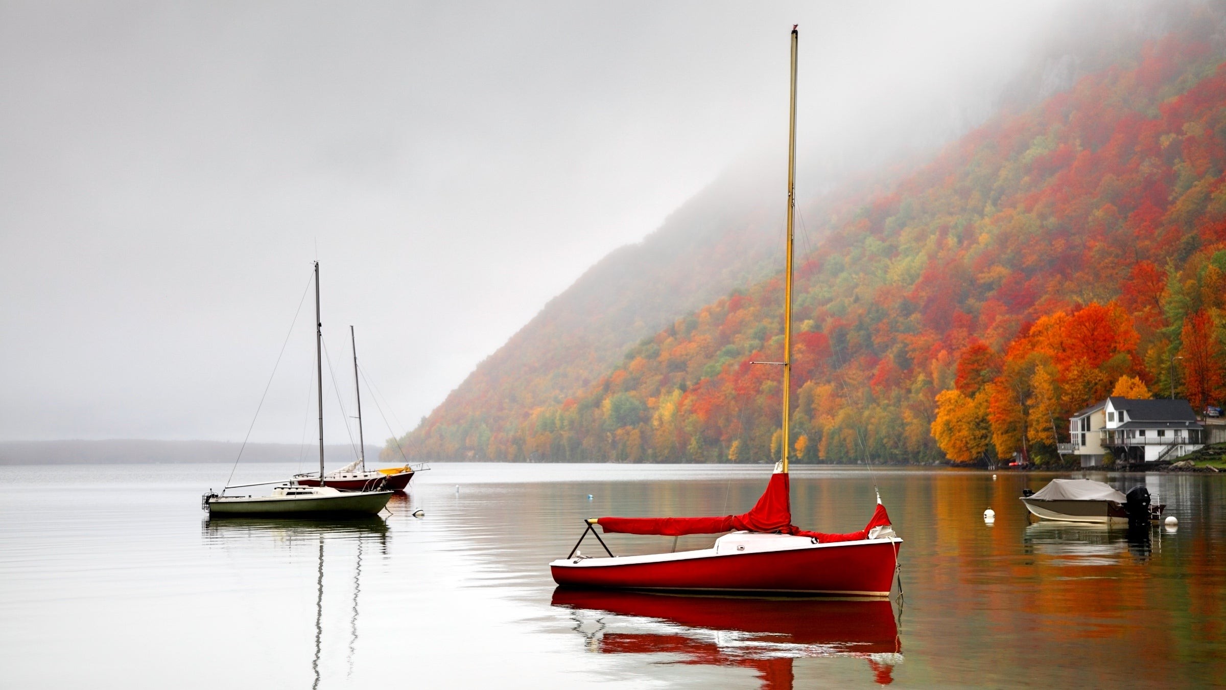 Boats are moored on Lake Willoughby, Vermont. It