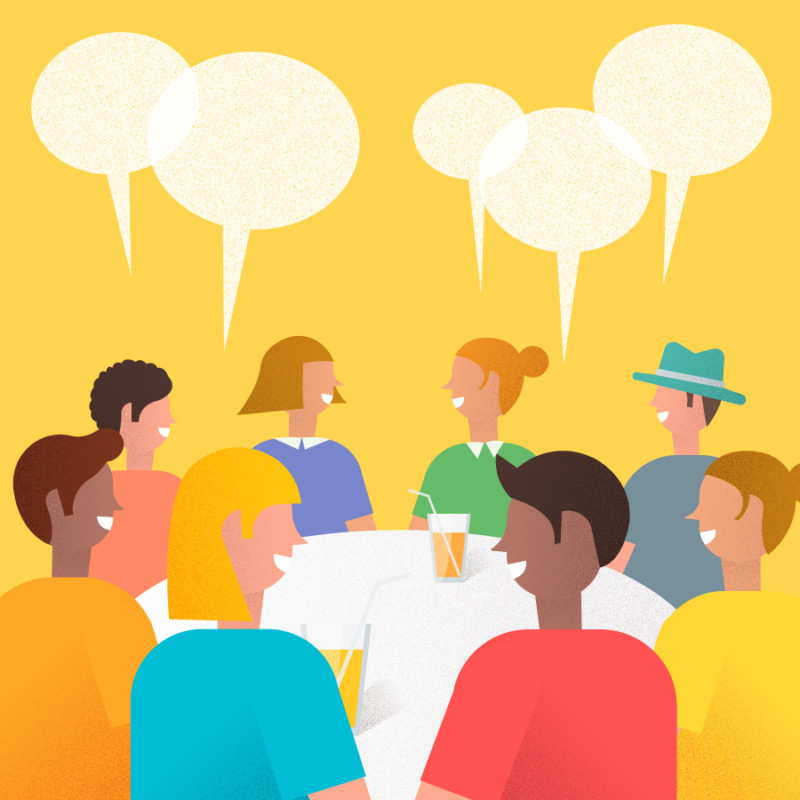 People collaborating at a local guides meetup, emphasizing networking.