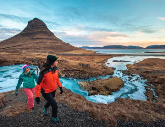 Icelandic adventure travelers looking at map