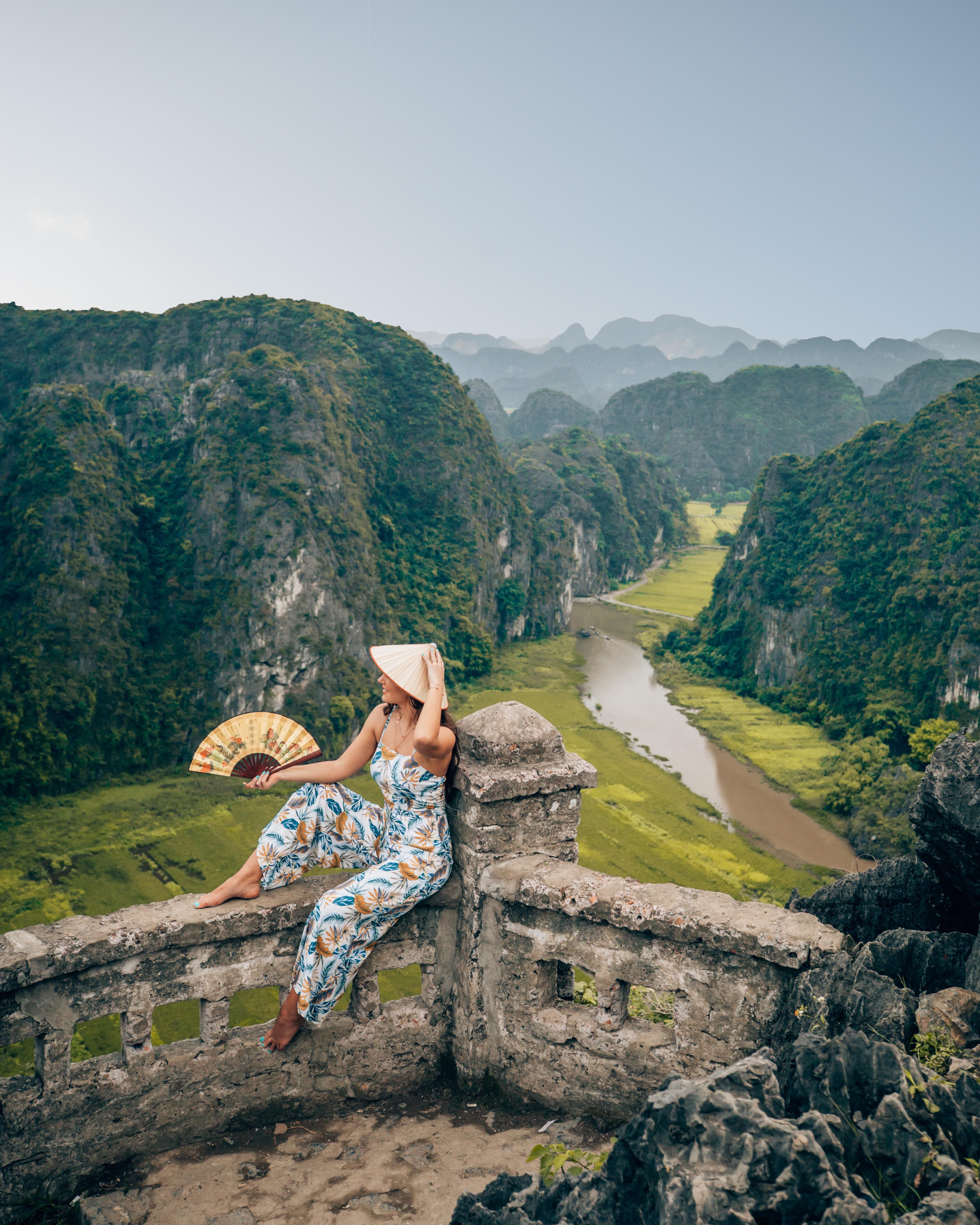 Sitting at the peak of Lying Dragon Mountain overlooking the mountains, rice fields and river