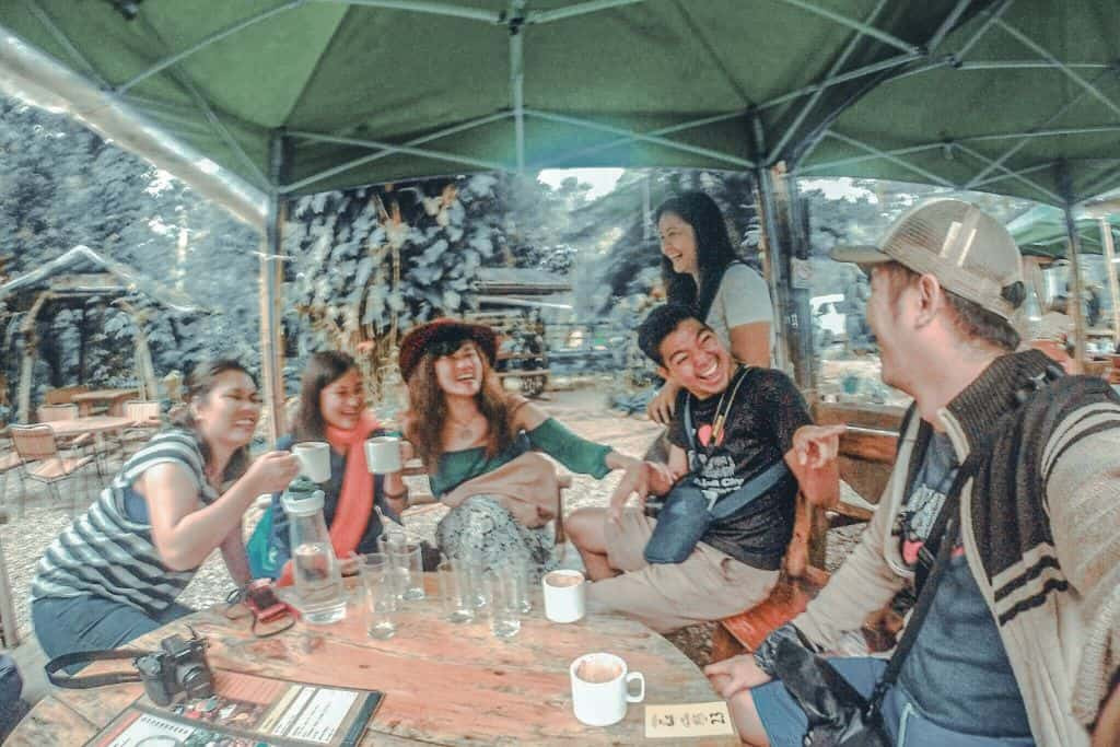 Friends enjoying hot chocolate at Choco-late de Batirol, Baguio, in a cozy and inviting atmosphere