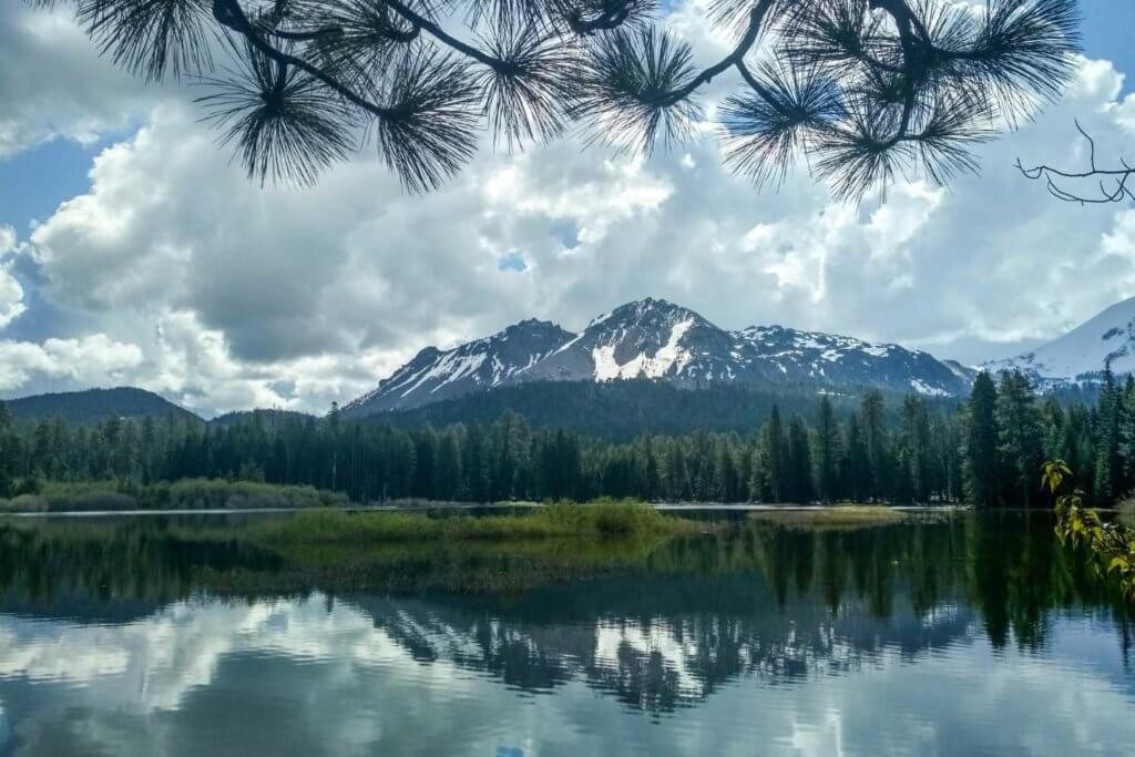 Clouds reflecting on Manzanita Lake, providing a serene spring scene in Plumas County