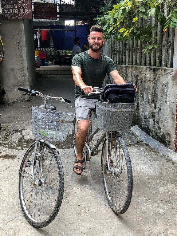 Mark sitting on our rented bikes in Tam Coc, ready to explore the countryside