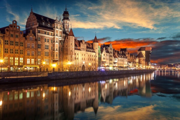 Kraków's Main Market Square showcases its UNESCO-listed medieval architecture, drawing tourists interested in historical sites and cultural heritage.