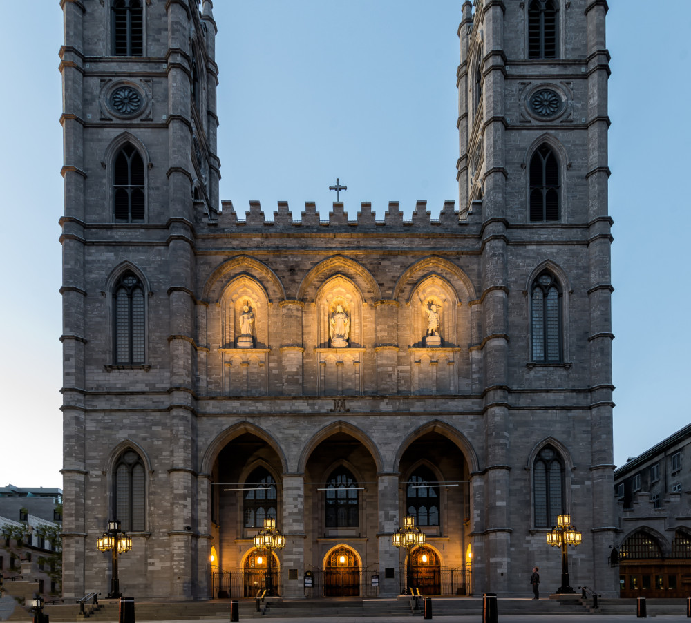 The exterior of the Notre Dame Cathedral in Montréal showcases its stunning Gothic architecture