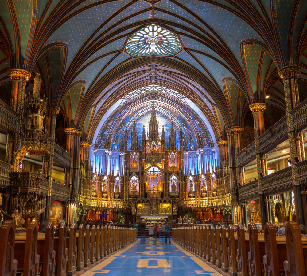 Inside the Notre Dame Cathedral of Montréal, the intricate design and vibrant colors create a breathtaking spectacle