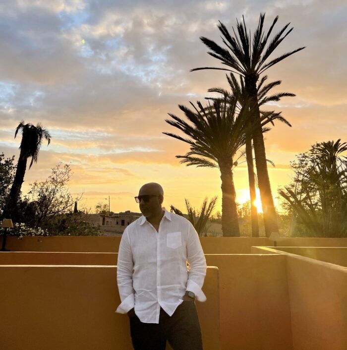 Sunset in Morocco and Parrish enjoys the view at rooftop in Jnane Tamsna