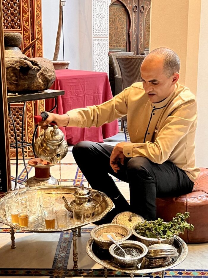 Mint tea being prepared during a cooking class, highlighting the traditional Moroccan beverage