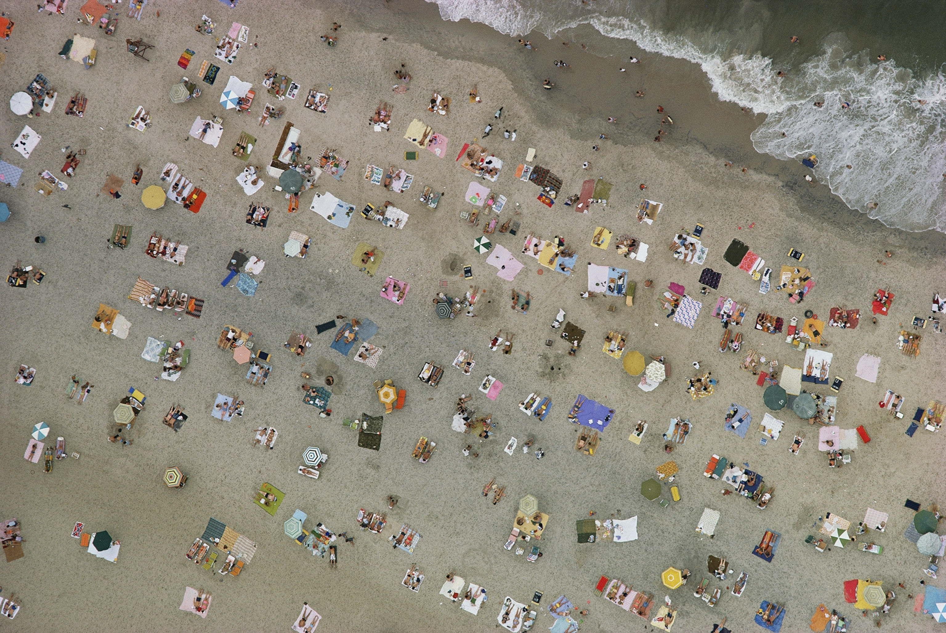 Sunbathers relaxing on the beach in Ocean City, Maryland, in 1967