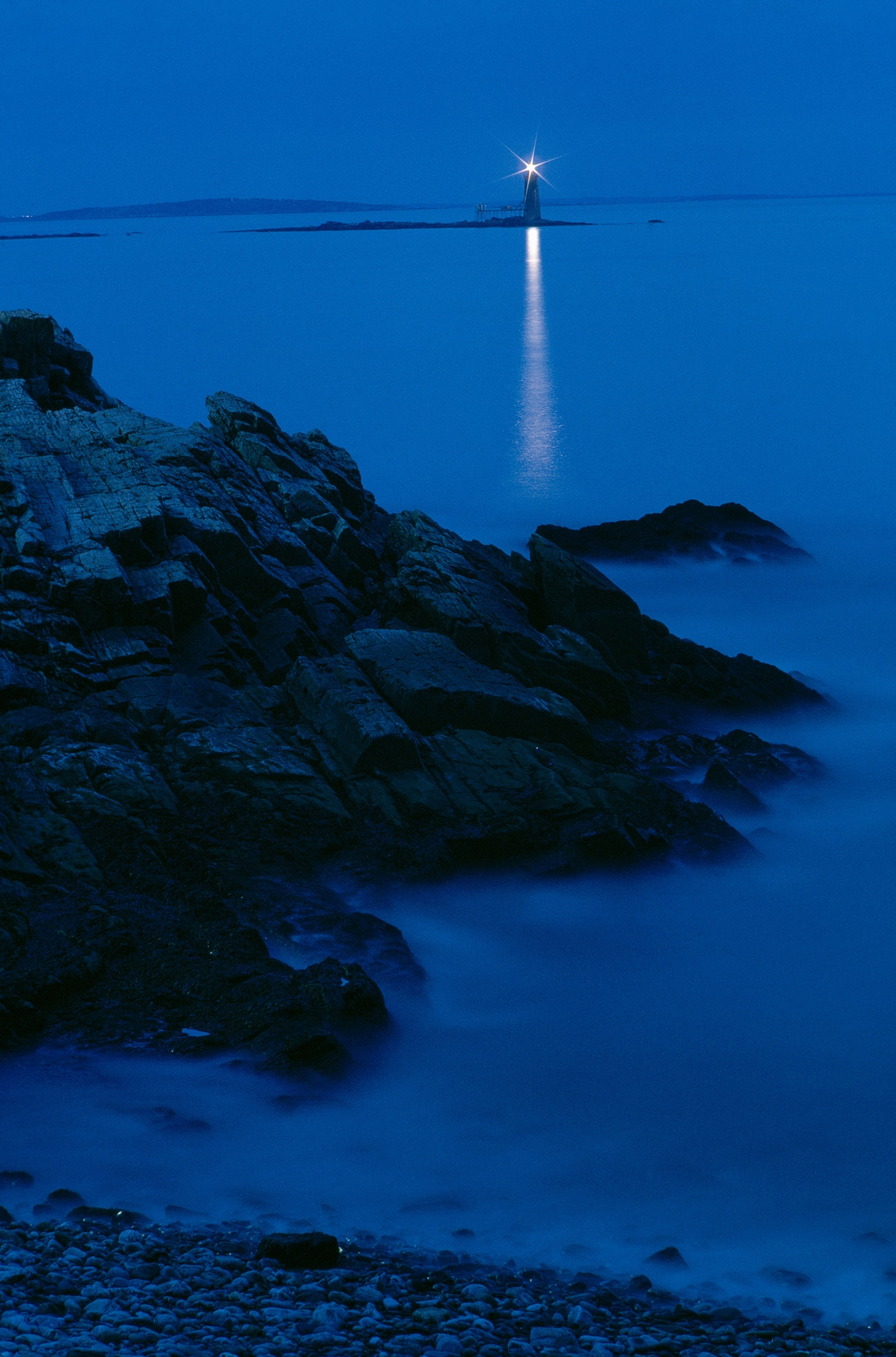 A night time exposure catches the bright beacon of Portland Head Lighthouse
