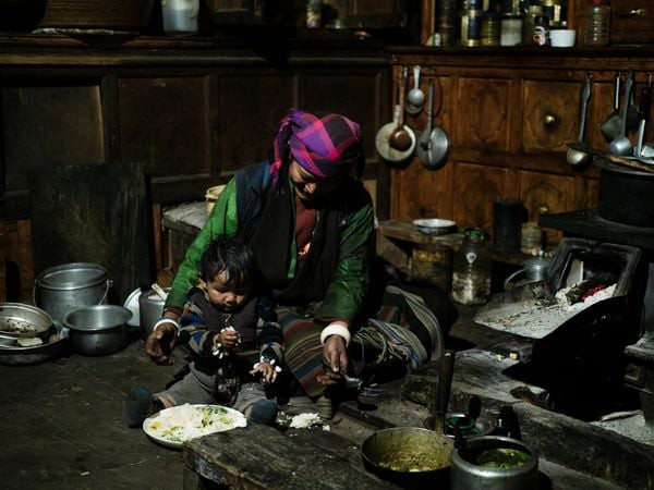 Teahouse host Bima and her son Tutankhamen in Ripchet, Tsum Valley Photo: Sarah Hewitt
